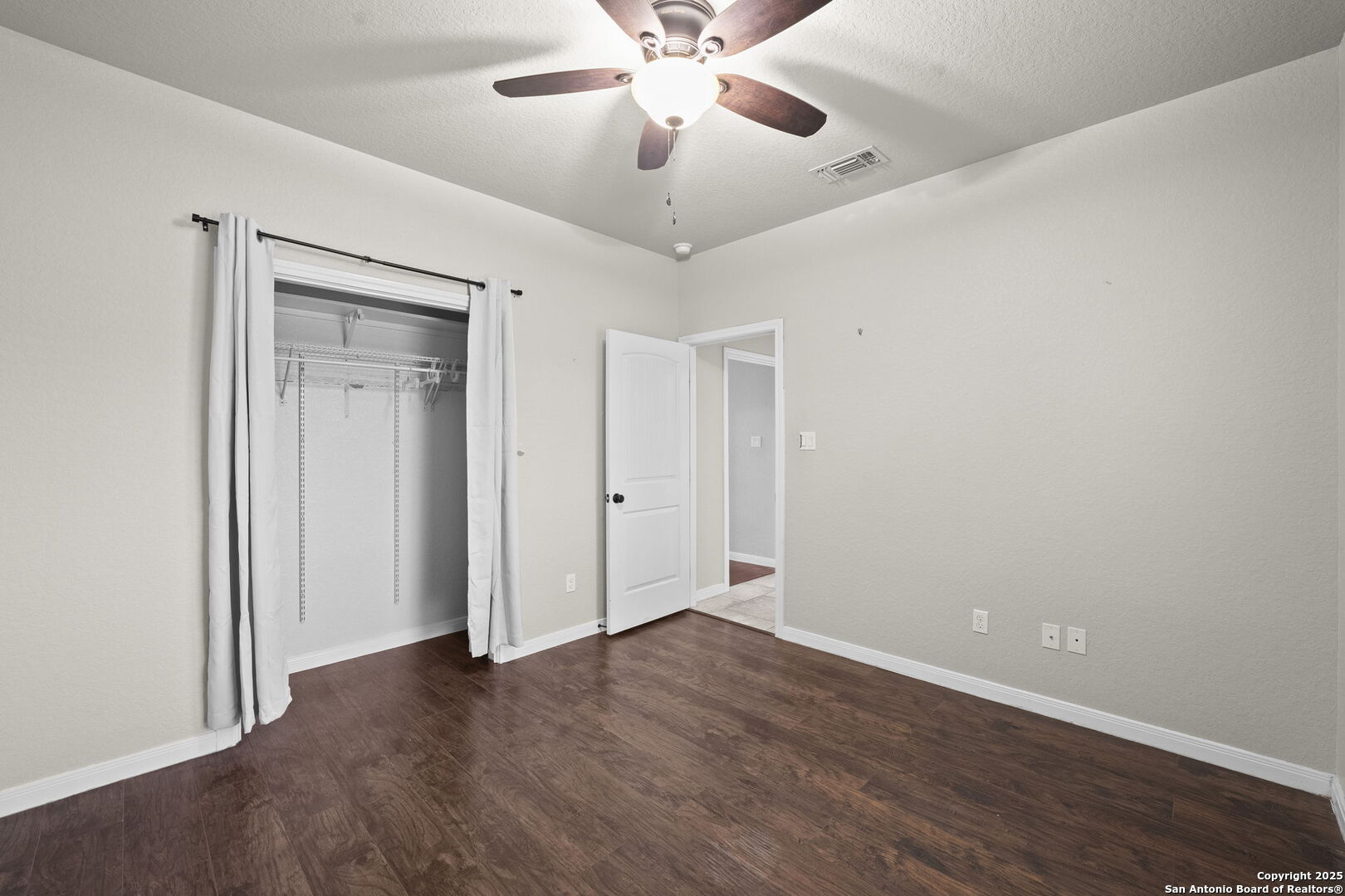 622 North Dickson Street Poth, TX 78147 - Photo 35 of 60 a view of an empty room with a ceiling fan and a ceiling fan