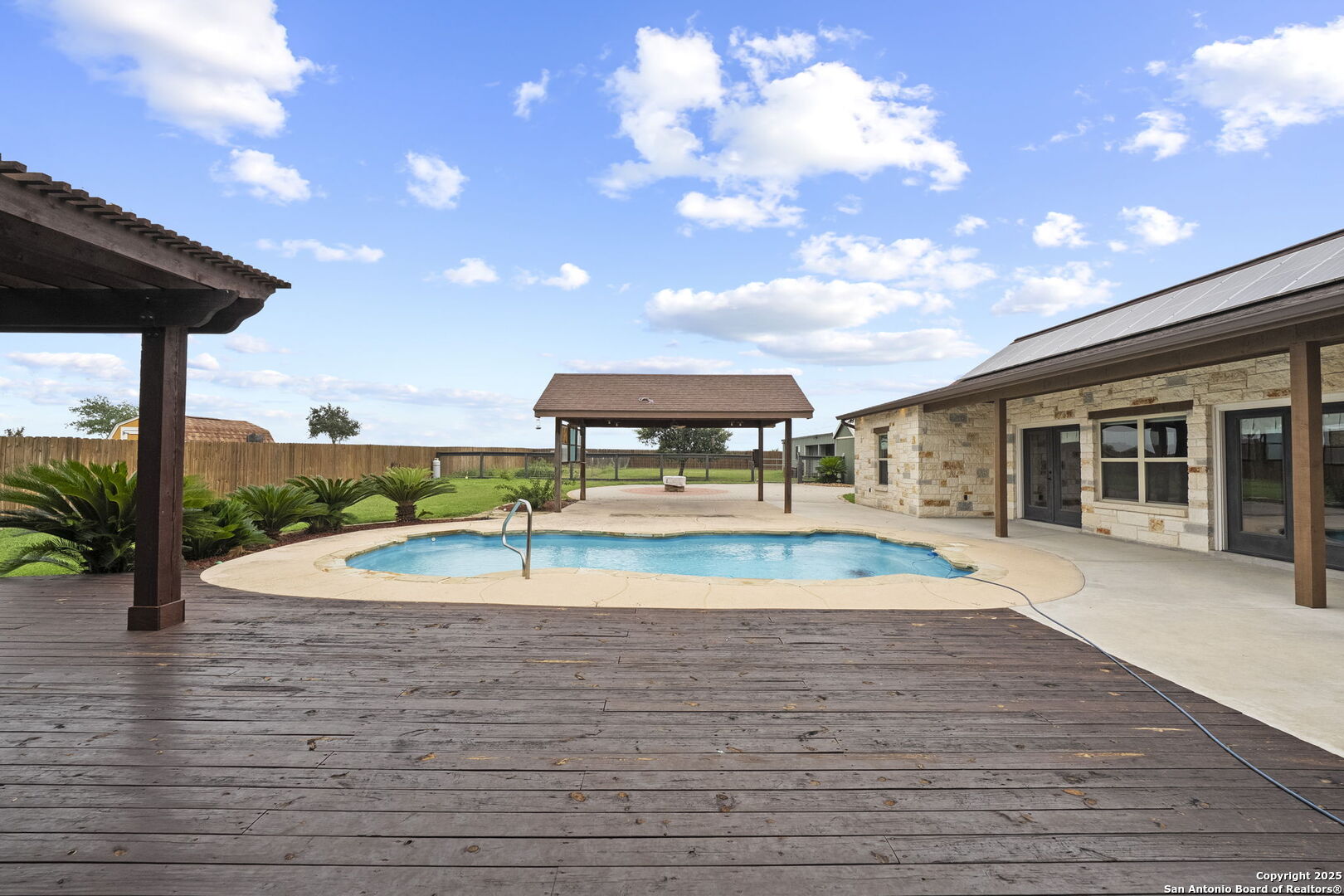 622 North Dickson Street Poth, TX 78147 - Photo 56 of 60 a view of a swimming pool with a patio