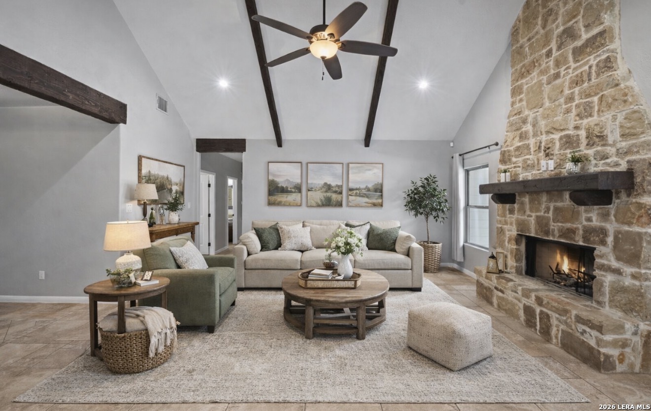 622 North Dickson Street Poth, TX 78147 - Photo 8 of 60 a living room with furniture fireplace and a chandelier