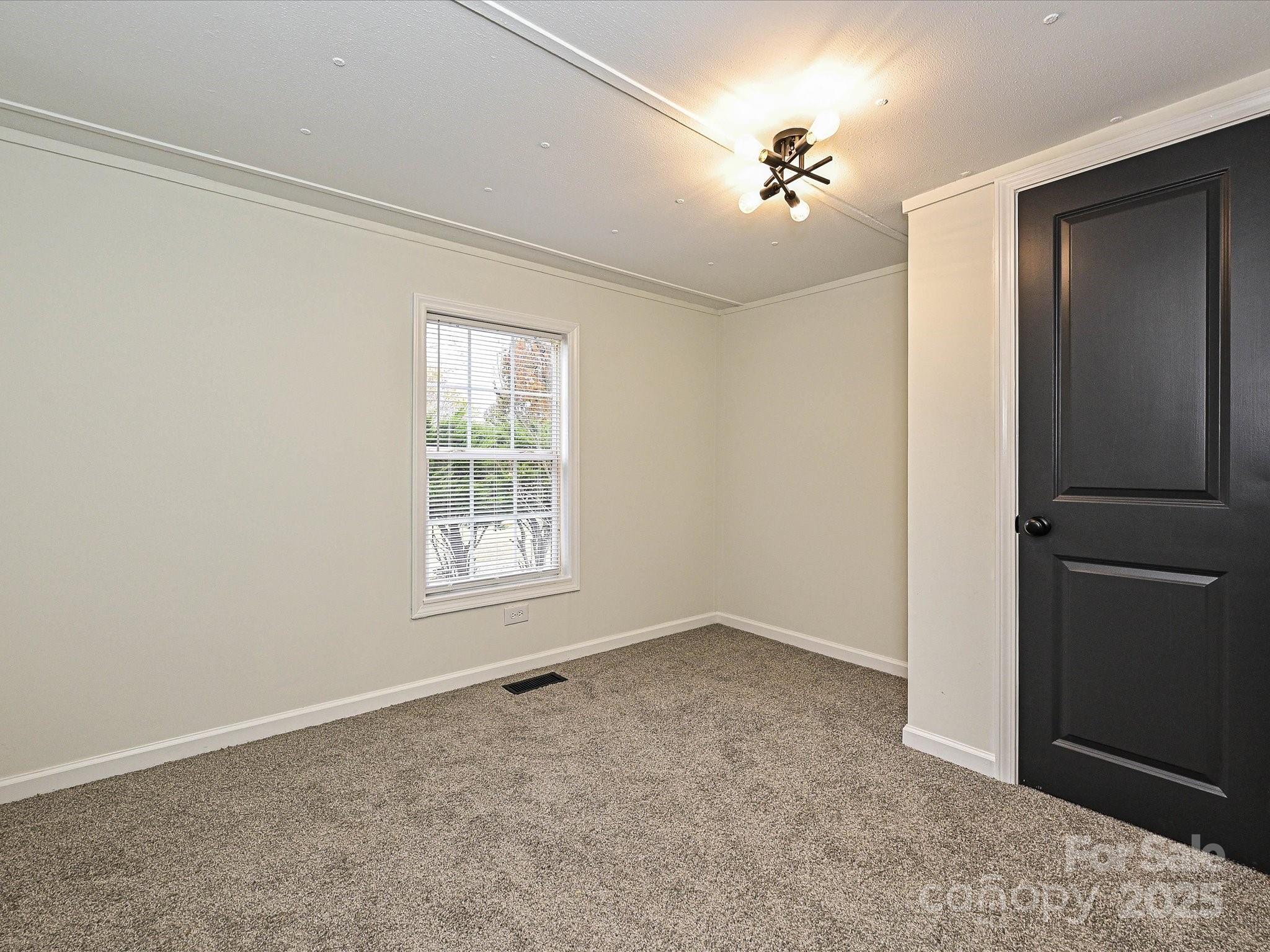3318 Loop Road Lincolnton, NC 28092 - Photo 16 of 27 a view of an empty room with a window