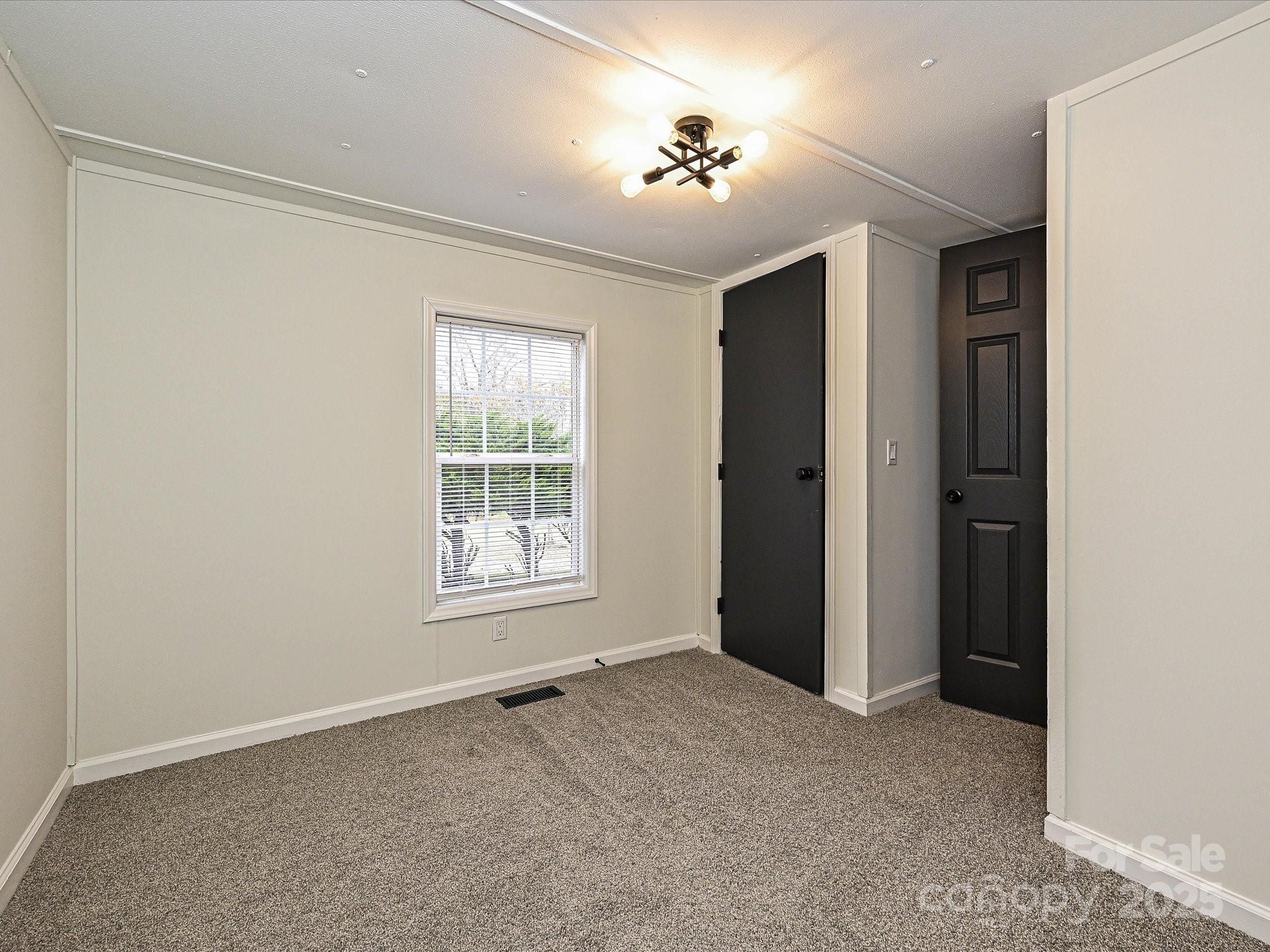3318 Loop Road Lincolnton, NC 28092 - Photo 19 of 27 a view of an empty room with a window