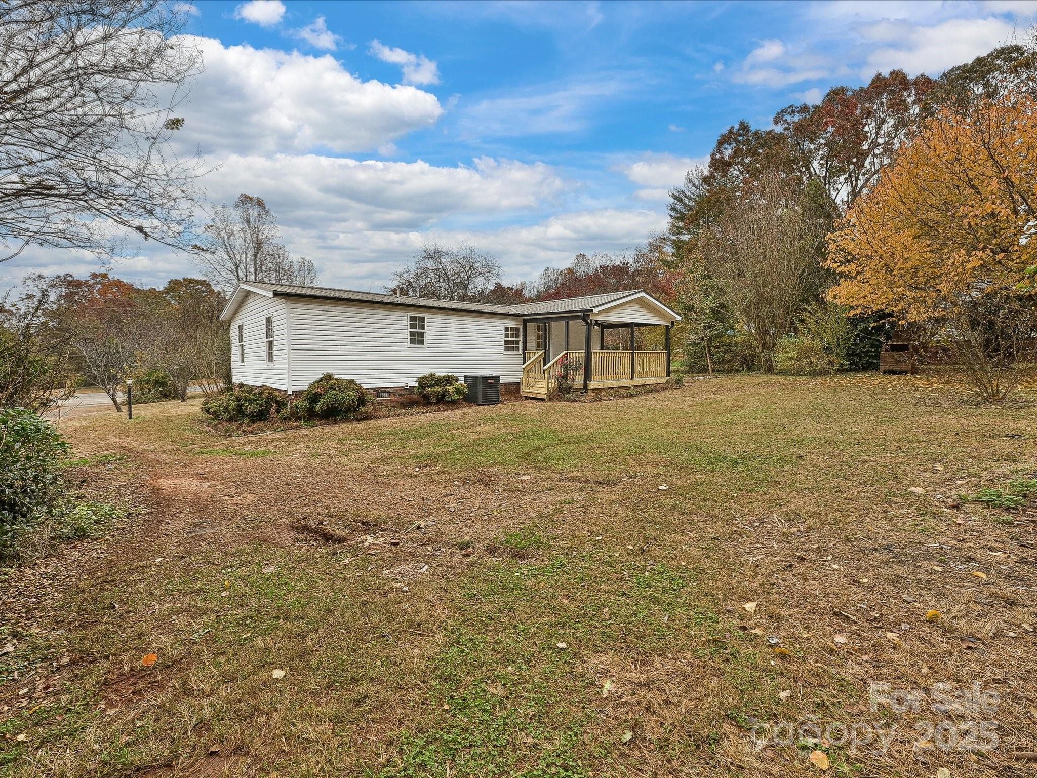 3318 Loop Road Lincolnton, NC 28092 - Photo 24 of 27 a view of a house with a yard