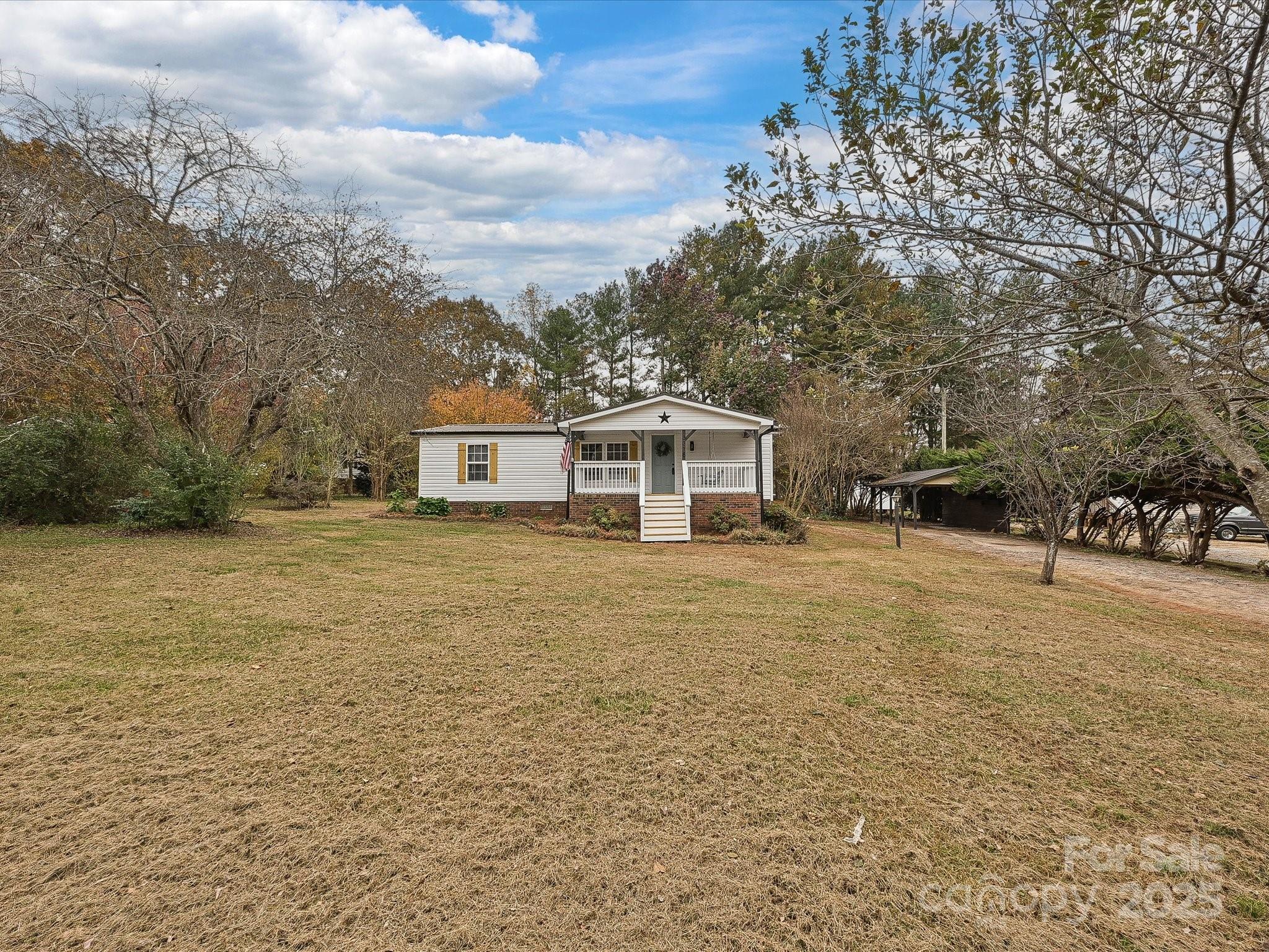 3318 Loop Road Lincolnton, NC 28092 - Photo 27 of 27 a front view of a house with a garden