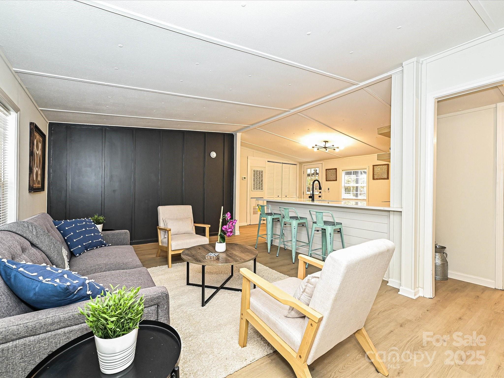 3318 Loop Road Lincolnton, NC 28092 - Photo 3 of 27 a living room with furniture and a potted plant