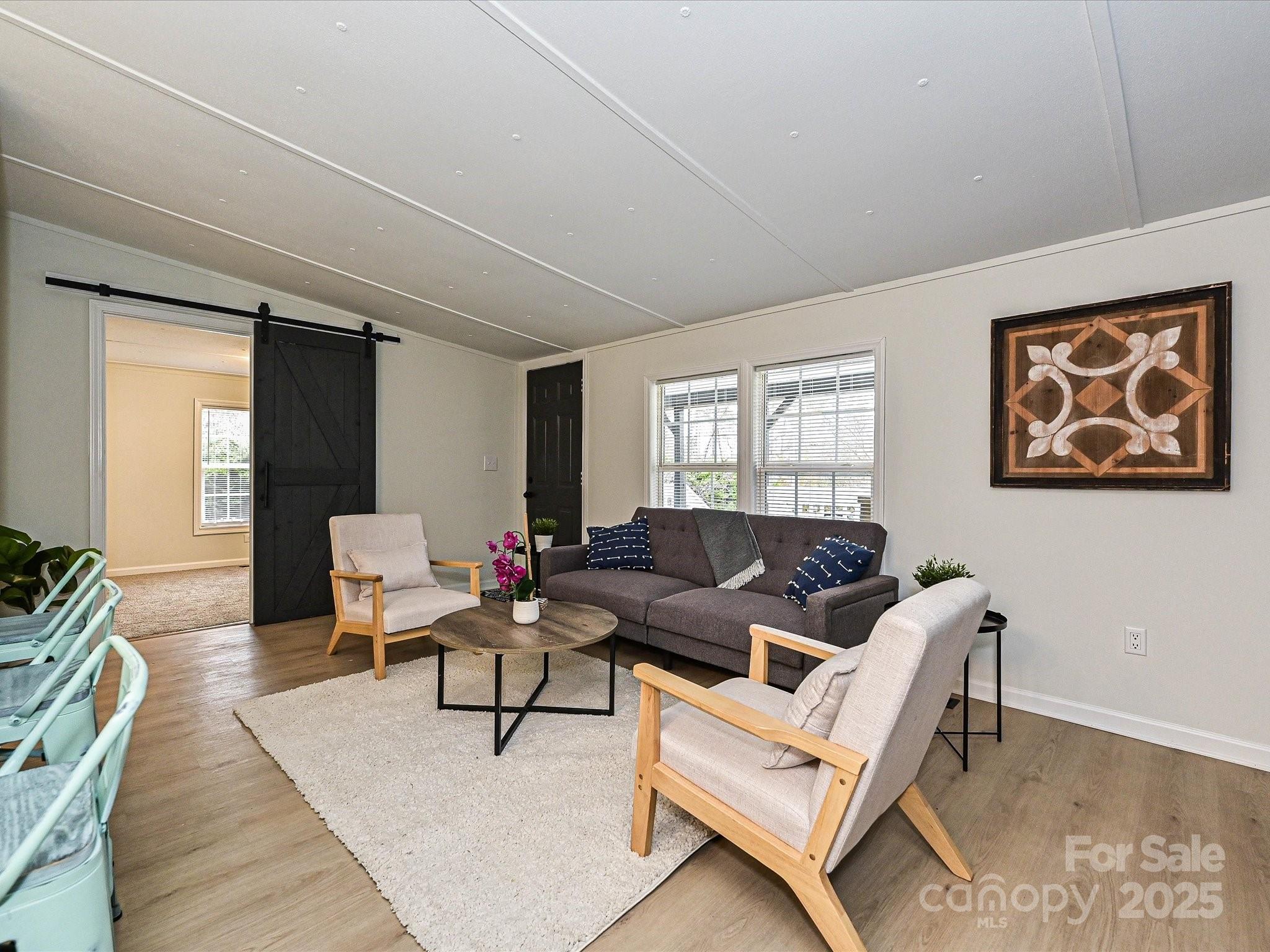 3318 Loop Road Lincolnton, NC 28092 - Photo 5 of 27 a living room with furniture and wooden floor