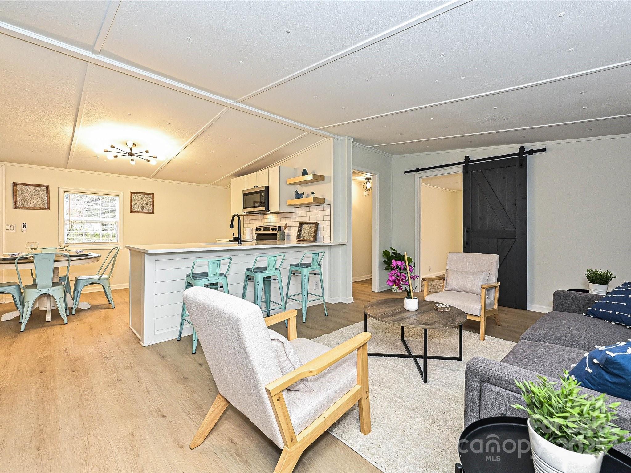 3318 Loop Road Lincolnton, NC 28092 - Photo 6 of 27 a living room with furniture and a wooden floor