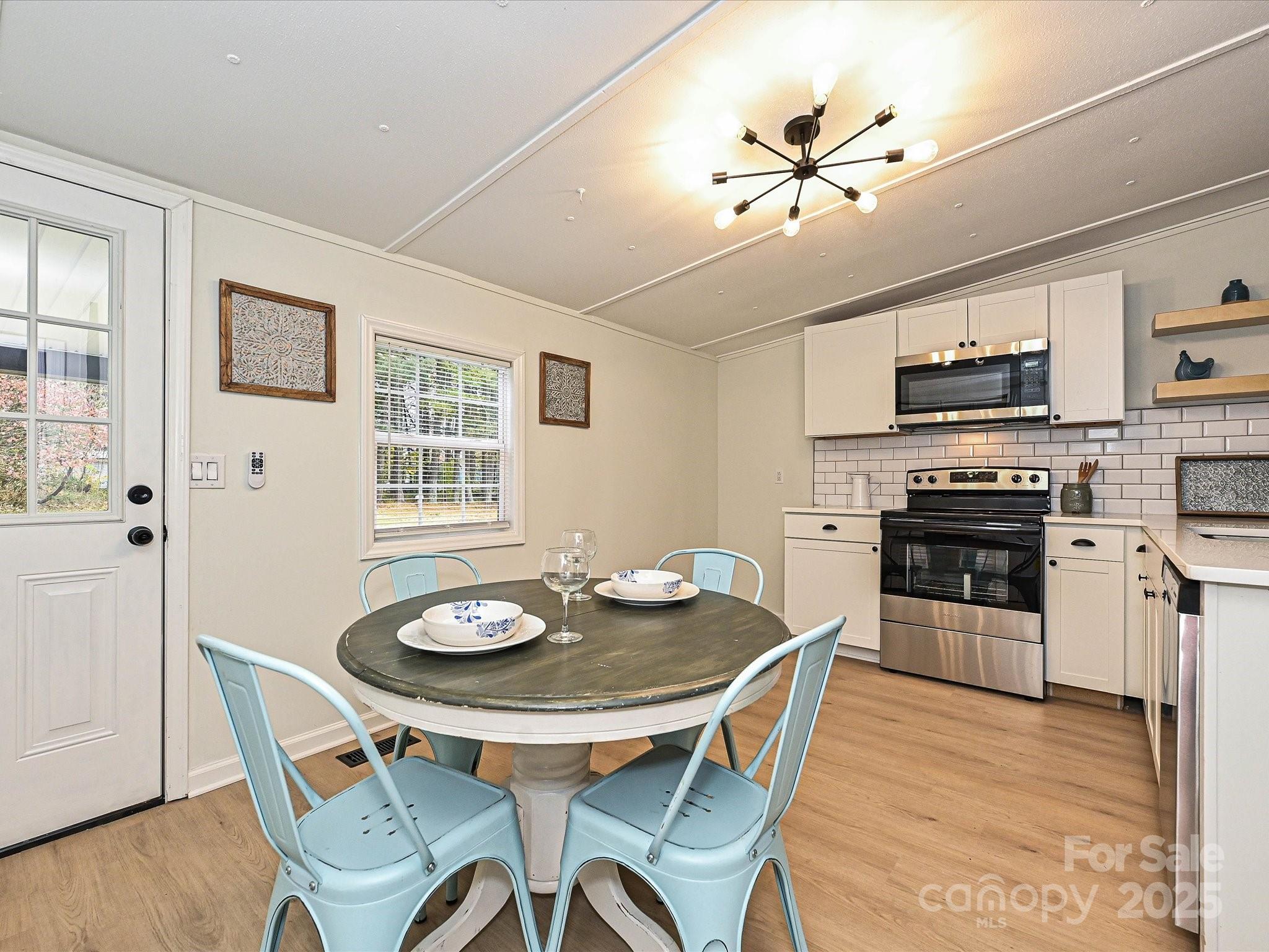 3318 Loop Road Lincolnton, NC 28092 - Photo 8 of 27 a view of a dining room with furniture and wooden floor