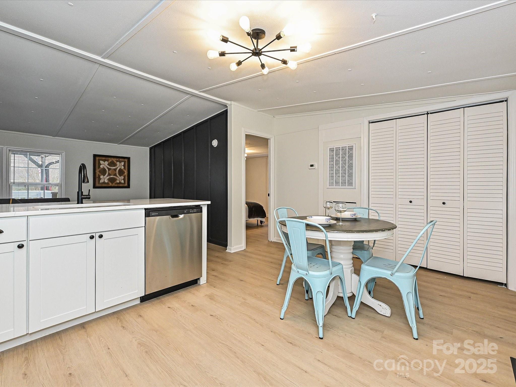 3318 Loop Road Lincolnton, NC 28092 - Photo 10 of 27 a view of a dining room with furniture and wooden floor