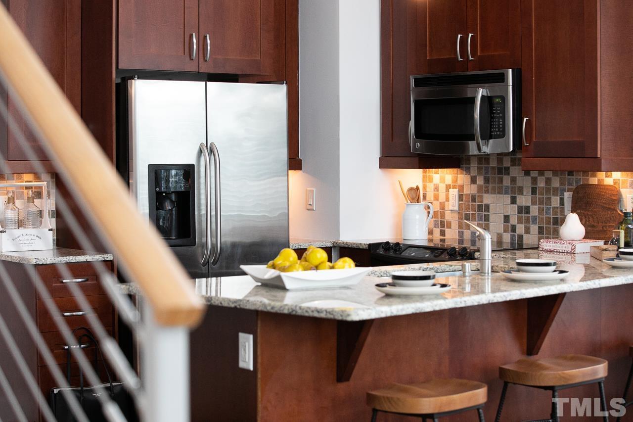 2608 Erwin Road, Unit 402 Durham, NC 27705 - Photo 11 of 33 a kitchen with a sink cabinets and stainless steel appliances