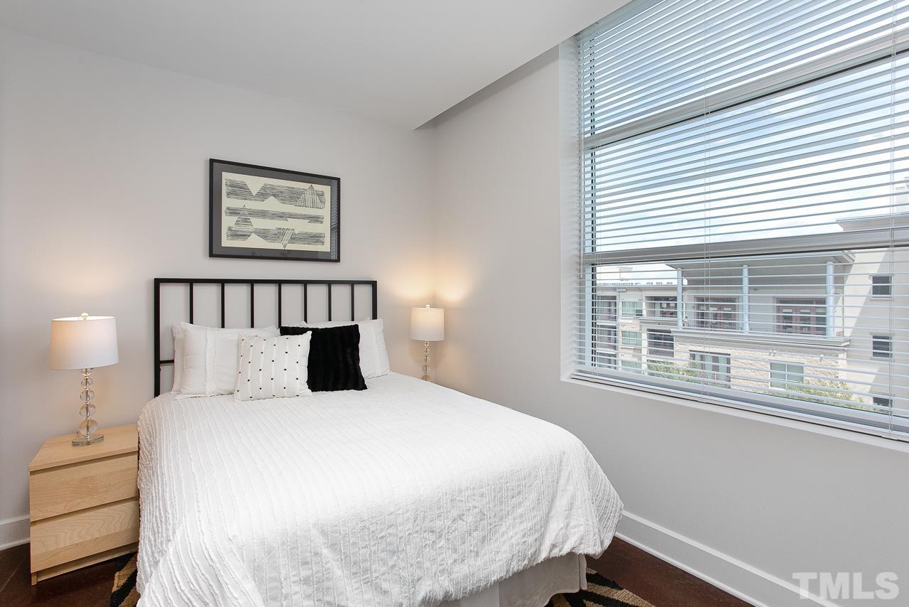 2608 Erwin Road, Unit 402 Durham, NC 27705 - Photo 13 of 33 a bedroom with a bed and a window