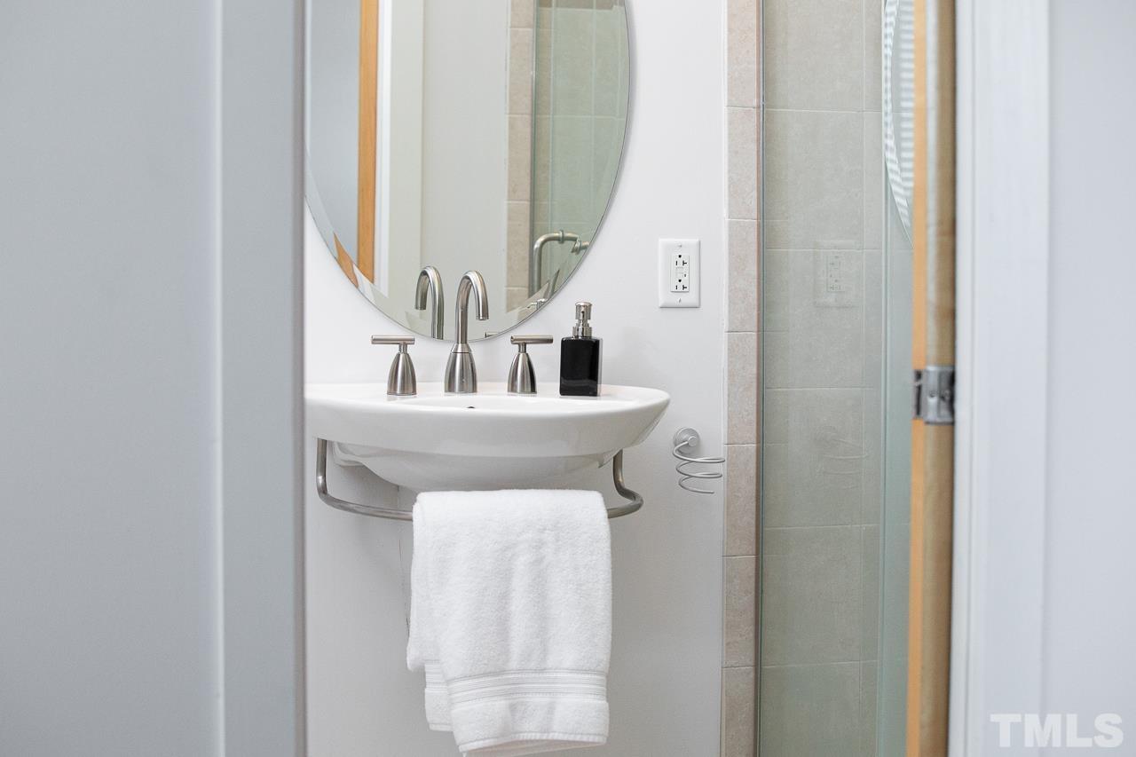 2608 Erwin Road, Unit 402 Durham, NC 27705 - Photo 15 of 33 a bathroom with a sink and a mirror
