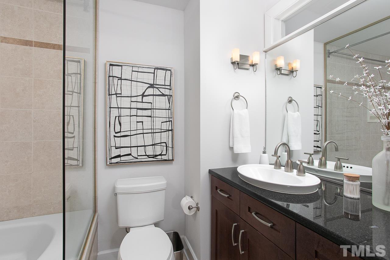 2608 Erwin Road, Unit 402 Durham, NC 27705 - Photo 20 of 33 a bathroom with a granite countertop sink toilet and shower