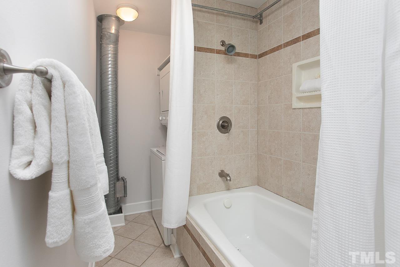 2608 Erwin Road, Unit 402 Durham, NC 27705 - Photo 23 of 33 a bathroom with a tub and a shower