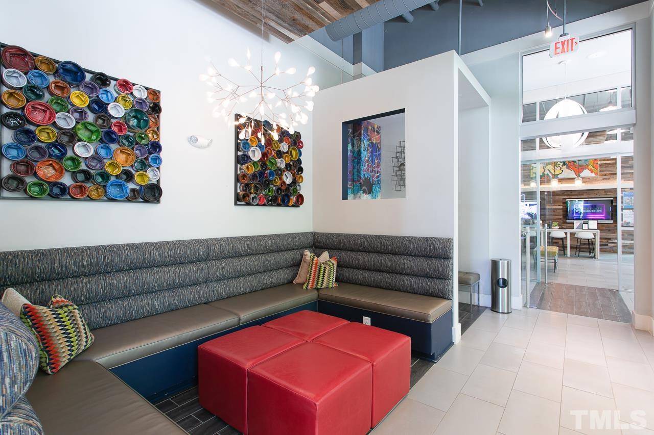 2608 Erwin Road, Unit 402 Durham, NC 27705 - Photo 30 of 33 a living room with furniture and a flat screen tv