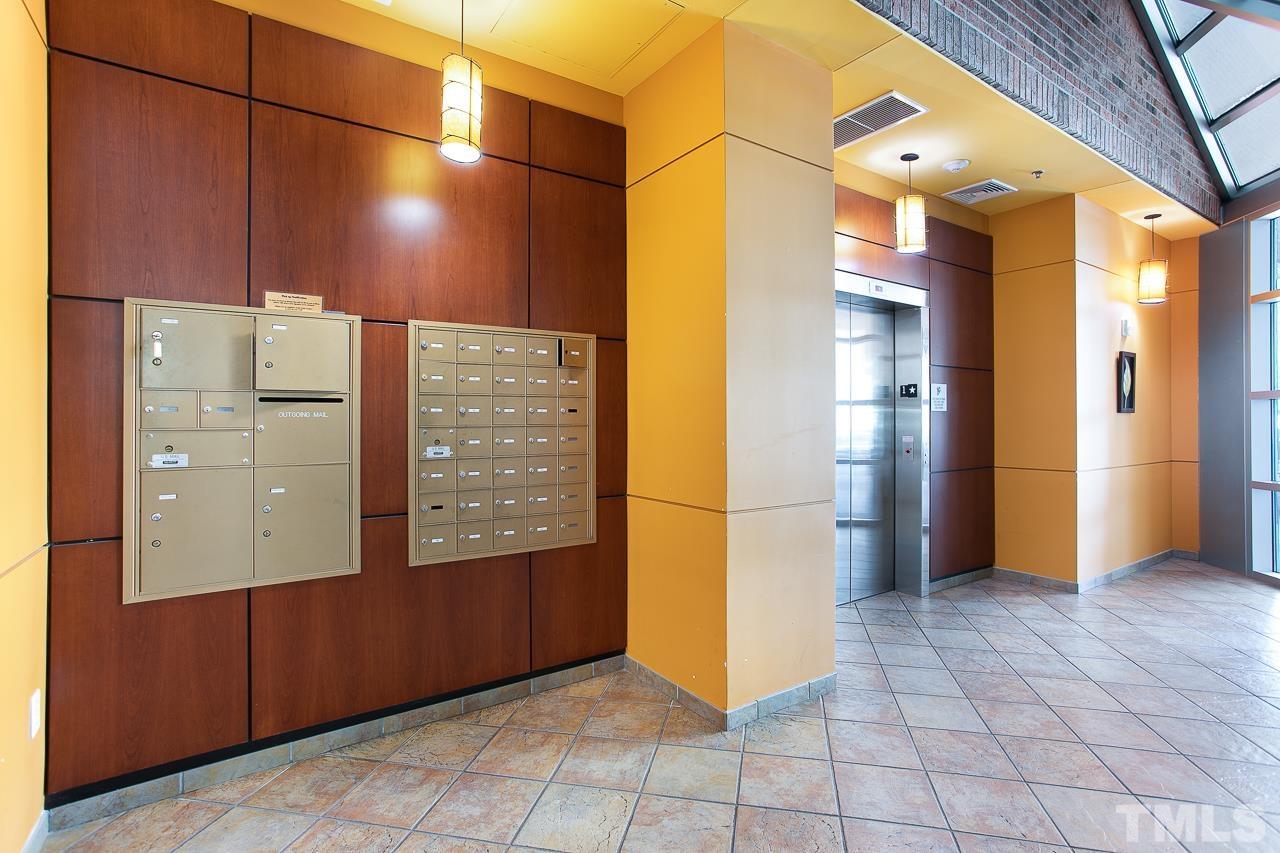2608 Erwin Road, Unit 402 Durham, NC 27705 - Photo 31 of 33 a view of a hallway with wooden walls
