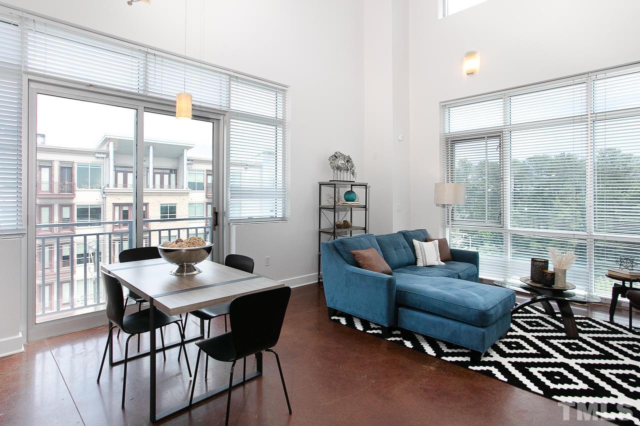 2608 Erwin Road, Unit 402 Durham, NC 27705 - Photo 4 of 33 a living room with furniture and a large window