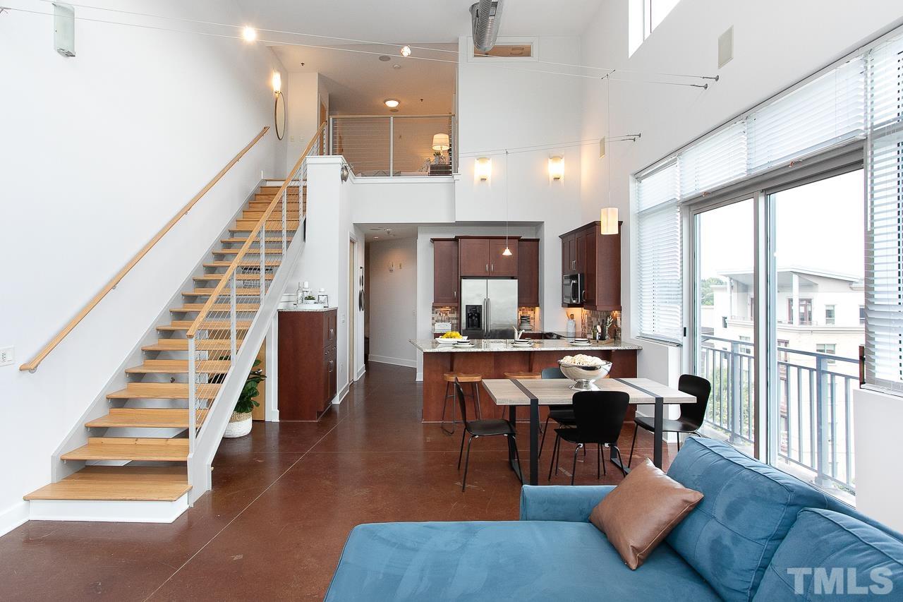 2608 Erwin Road, Unit 402 Durham, NC 27705 - Photo 5 of 33 a view of a dining room with furniture window and wooden floor