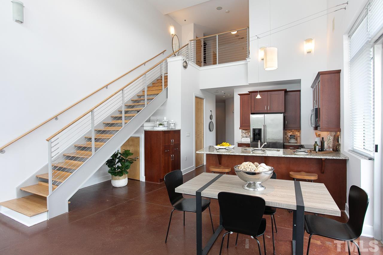 2608 Erwin Road, Unit 402 Durham, NC 27705 - Photo 6 of 33 a view of a dining room with furniture and wooden floor