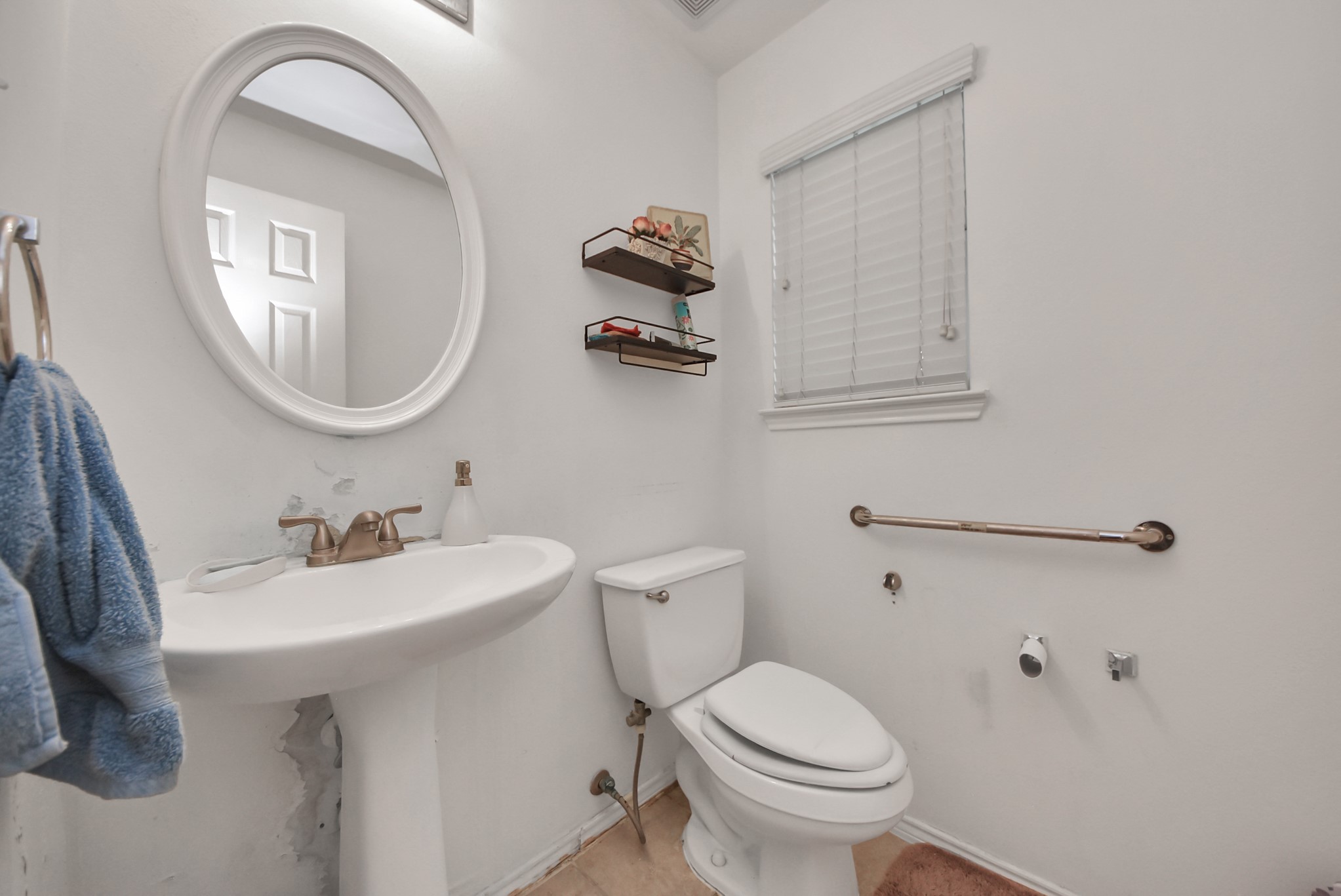 10003 Dakota Ridge Court Houston, TX 77095 - Photo 14 of 30 a bathroom with a toilet sink and mirror