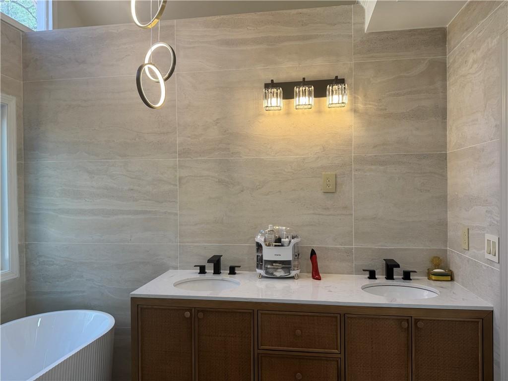 790 Hiram Davis Road Lawrenceville, GA 30045 - Photo 13 of 21 a bathroom with a sink a toilet and mirror