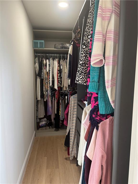 790 Hiram Davis Road Lawrenceville, GA 30045 - Photo 15 of 21 a view of walk in closet with clothes and shoes
