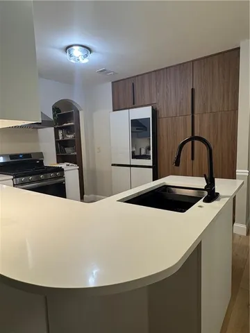 a kitchen with a stove and a refrigerator