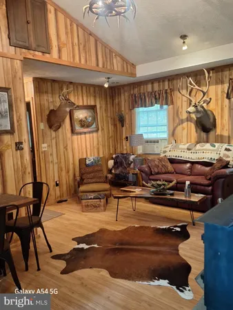 a living room with furniture a couch and a table