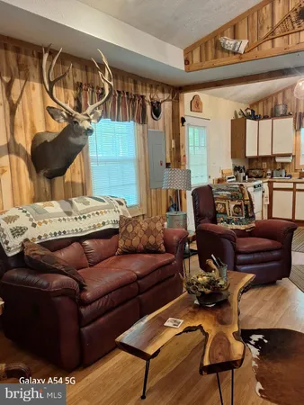 a livingroom with furniture and wooden floor