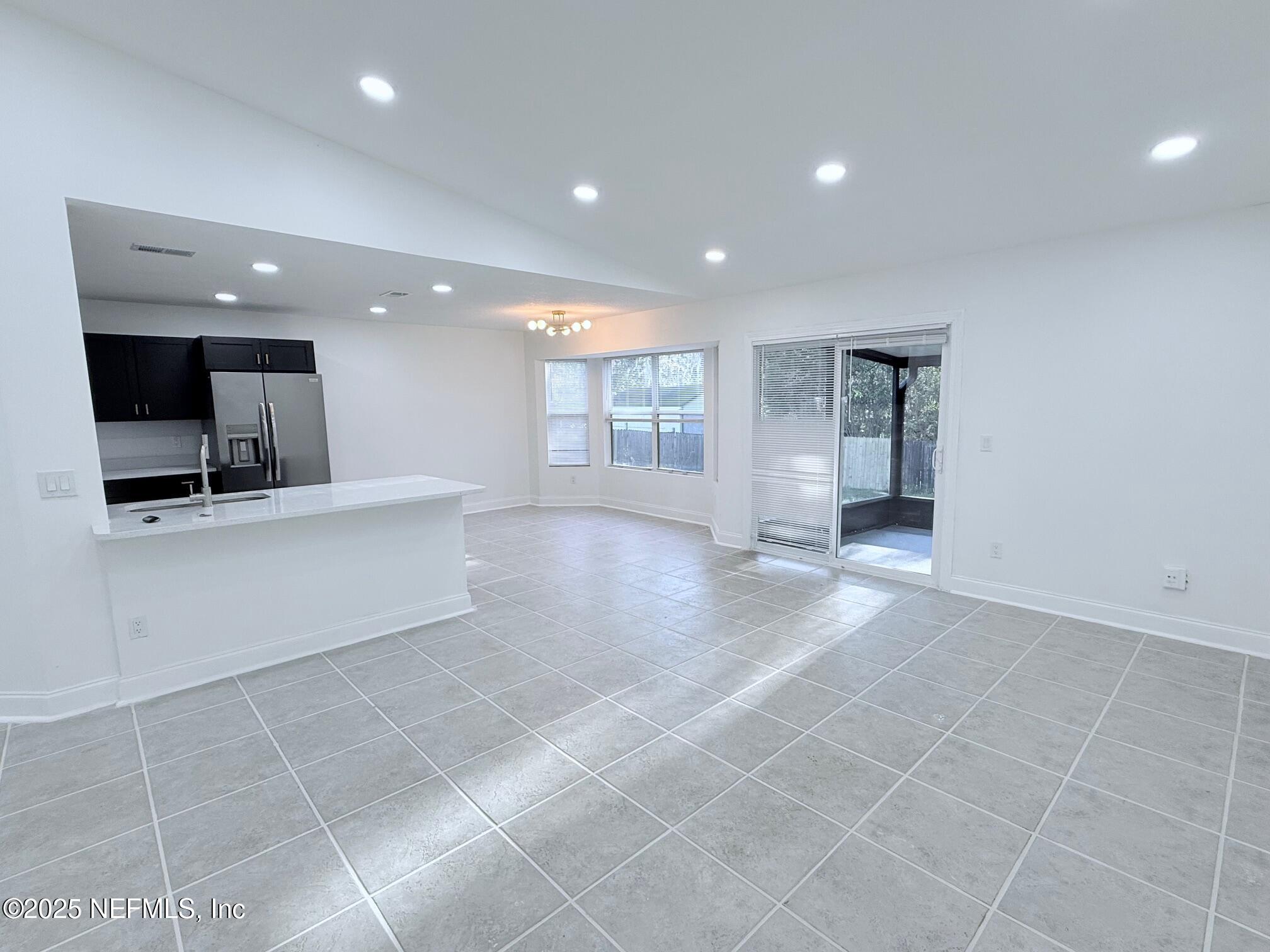 2160 Rothbury Drive Jacksonville, FL 32221 - Photo 17 of 31 a view of a kitchen with a sink and a window