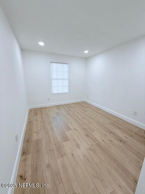 2160 Rothbury Drive Jacksonville, FL 32221 - Photo 26 of 31 an empty room with wooden floor and windows