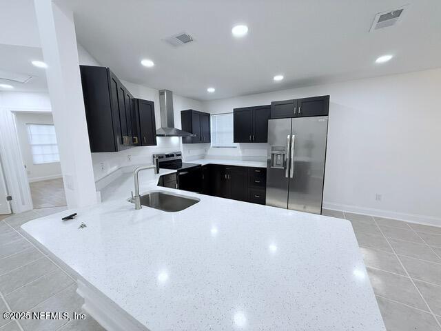 2160 Rothbury Drive Jacksonville, FL 32221 - Photo 5 of 31 a kitchen with stainless steel appliances a refrigerator sink and microwave