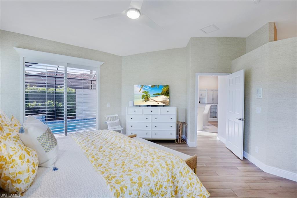 10304 Cape Roman Road, Unit 102 Estero, FL 34135 - Photo 16 of 39 Master Bedroom Suite