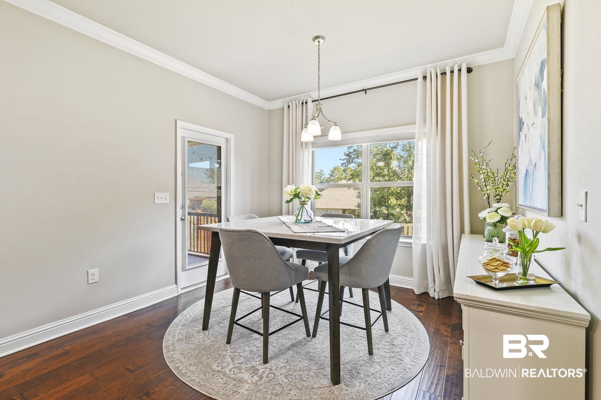 31500 Spoonbill Road Daphne, AL 36527 - Photo 22 of 85 Dining area with dark hardwood / wood-style flooring, a notable chandelier, and crown molding