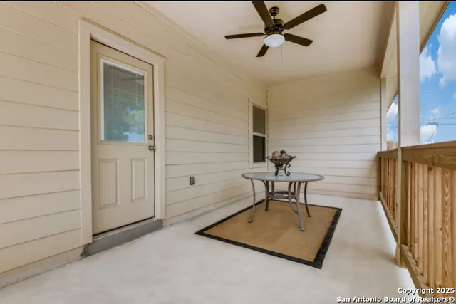 a view of a livingroom with a table and chairs
