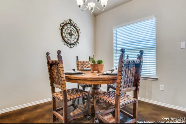 a dining room with furniture and window