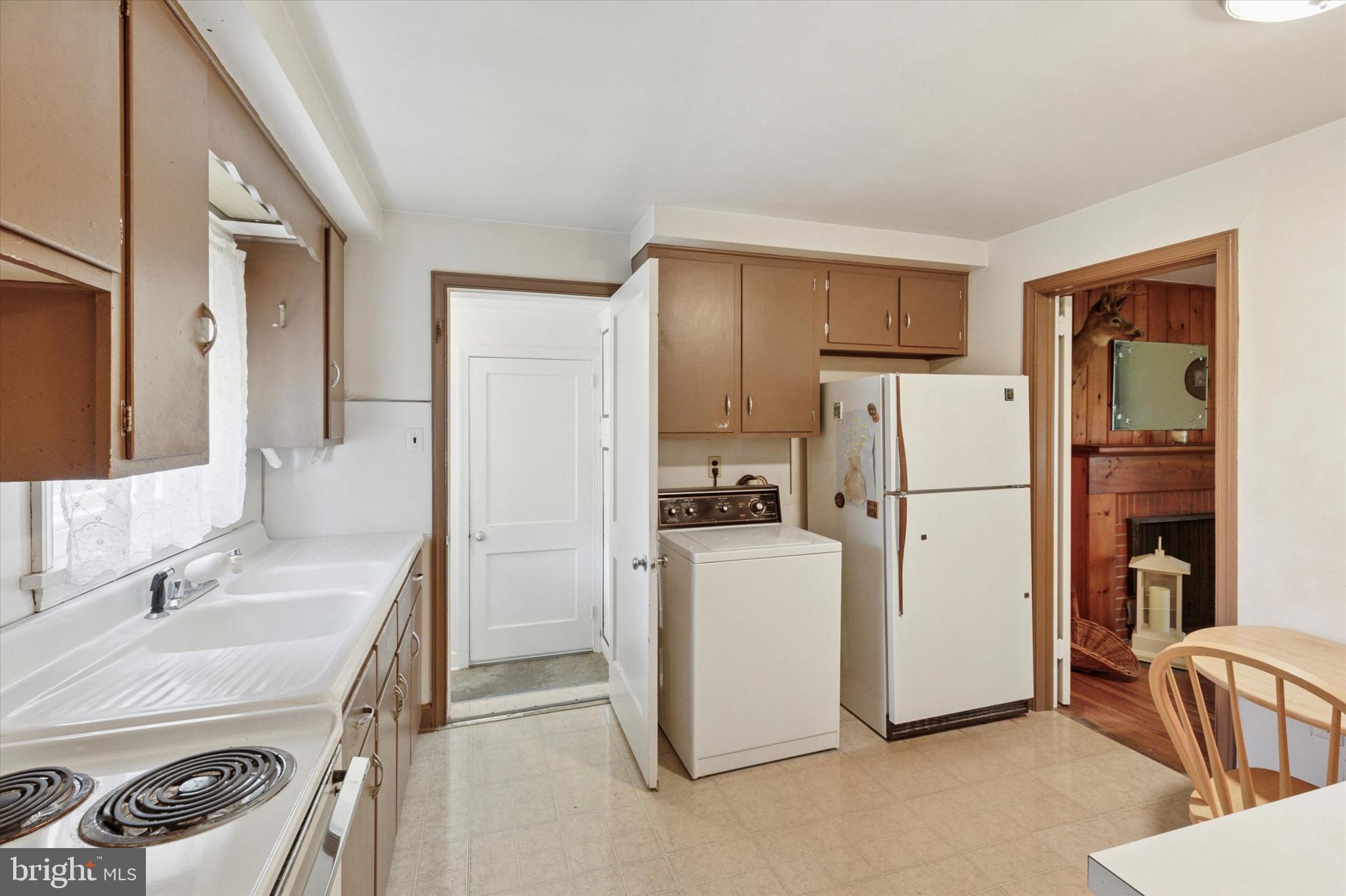350 Dowlin Forge Road Exton, PA 19341 - Photo 11 of 27 a utility room with cabinets washer and dryer