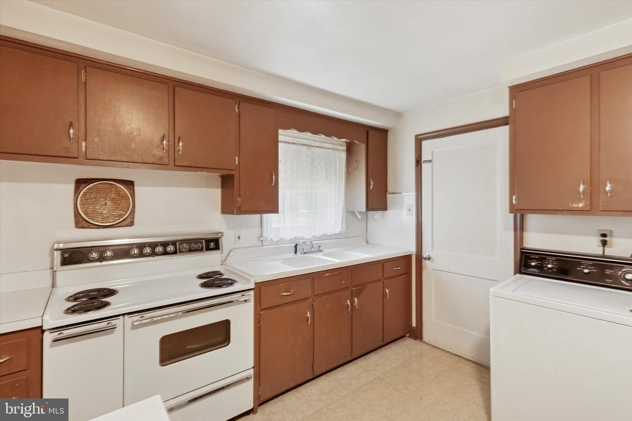 350 Dowlin Forge Road Exton, PA 19341 - Photo 12 of 27 a kitchen with a stove a sink and a refrigerator