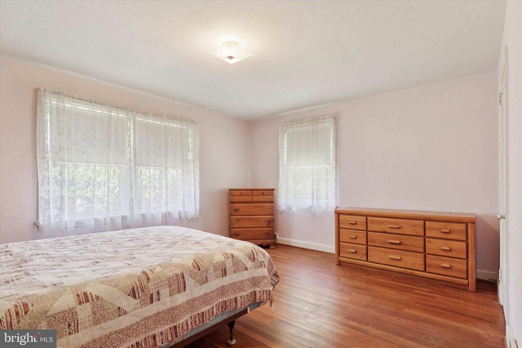 350 Dowlin Forge Road Exton, PA 19341 - Photo 14 of 27 a bedroom with a bed and a dresser