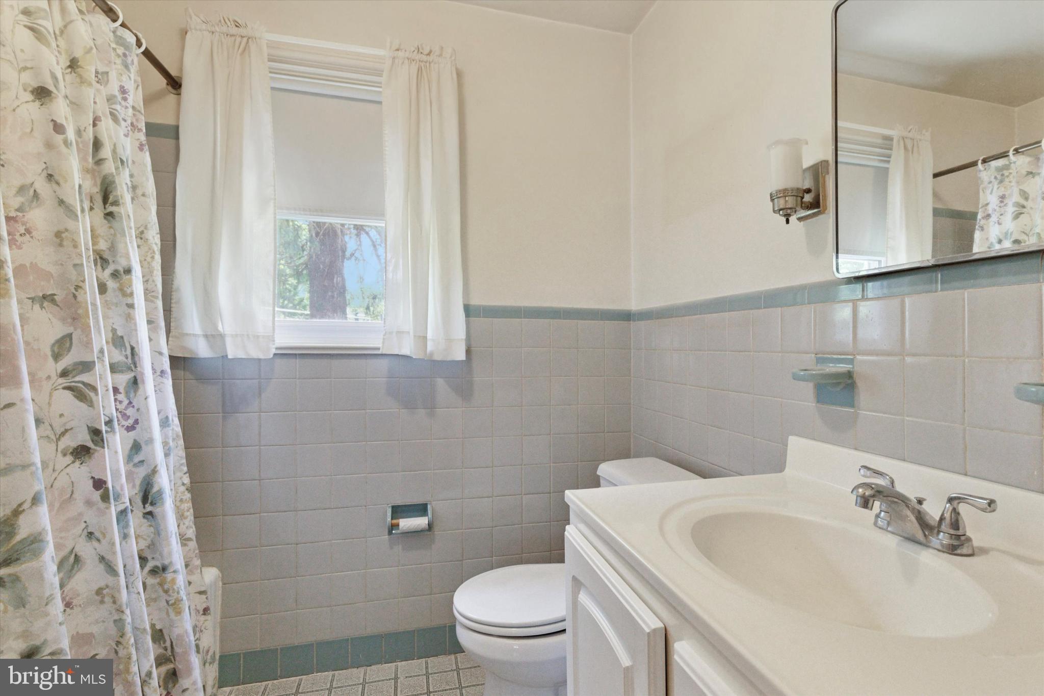 350 Dowlin Forge Road Exton, PA 19341 - Photo 16 of 27 a bathroom with a sink a toilet and a mirror