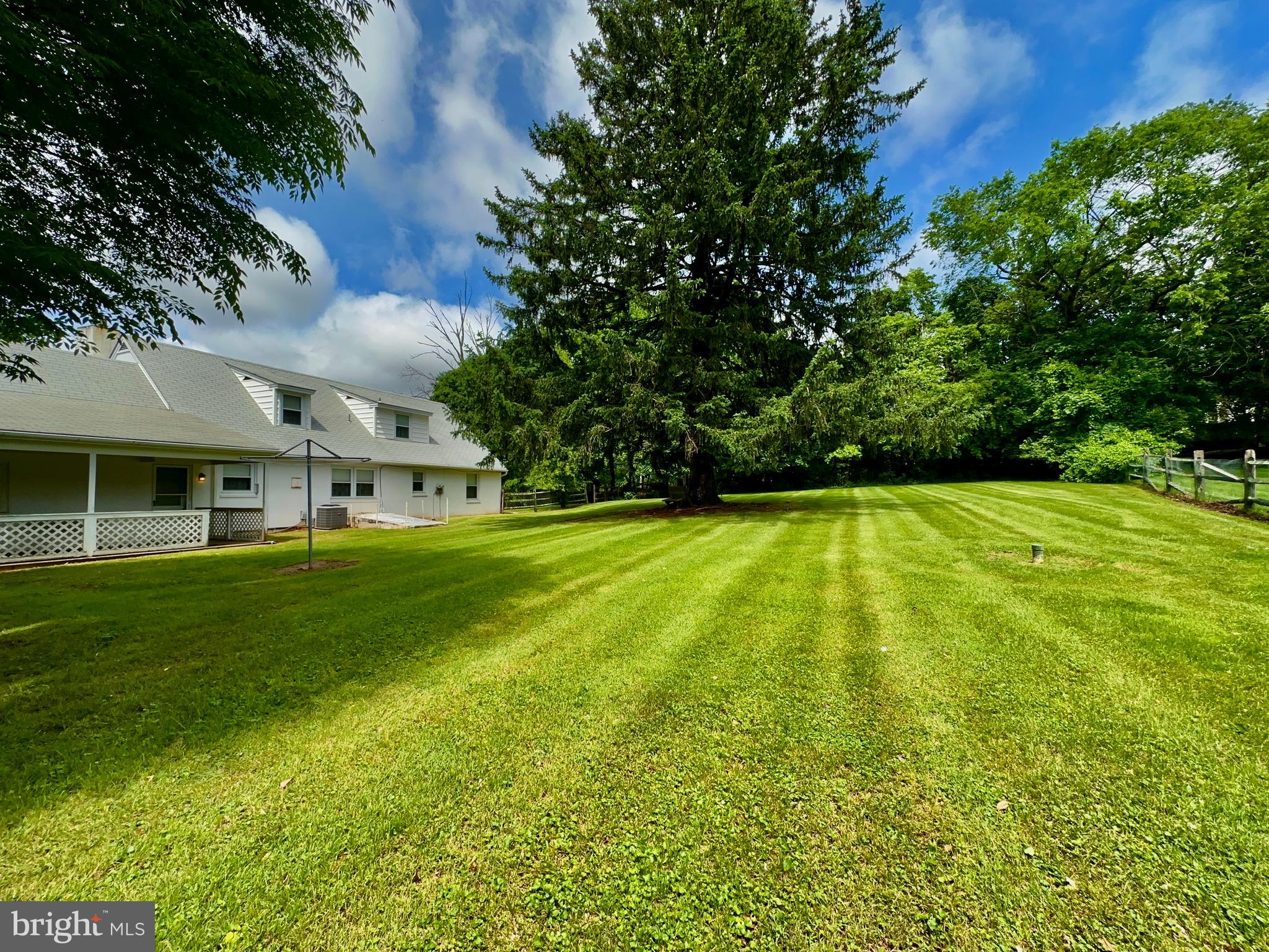 350 Dowlin Forge Road Exton, PA 19341 - Photo 23 of 27 a view of yard with swimming pool and green space