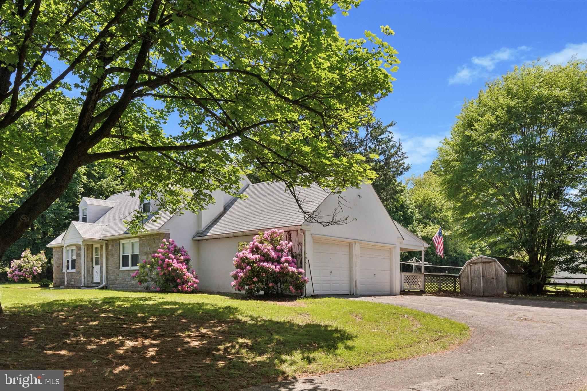 350 Dowlin Forge Road Exton, PA 19341 - Photo 3 of 27 a front view of a house with a yard and garage