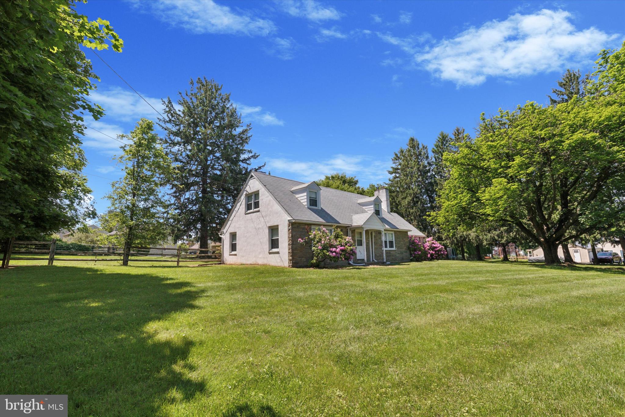 350 Dowlin Forge Road Exton, PA 19341 - Photo 5 of 27 a view of a tree in front of a house with a big yard