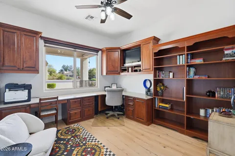 a room with cabinets furniture and a window