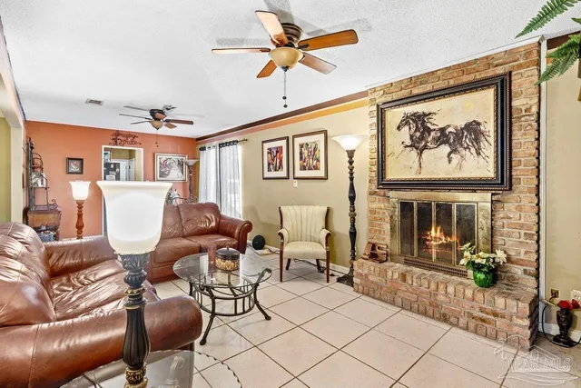 a living room with furniture a table and a painting