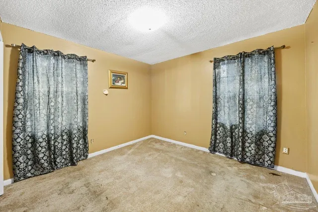 a view of a bathroom with a shower curtain