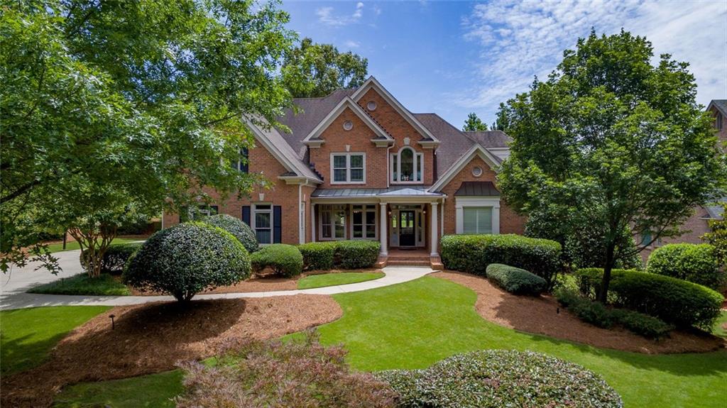 3320 Moye Trail Duluth, GA 30097 - Photo 1 of 1 a front view of a house with garden
