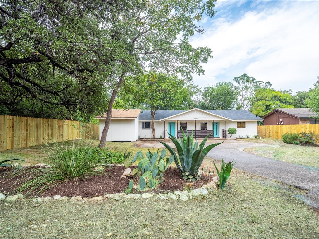 7004 Circle S Road, Unit B Austin, TX 78745 - Photo 1 of 12 Lush landscaping and a lengthy driveway enhance the curb appeal of this charming residence.