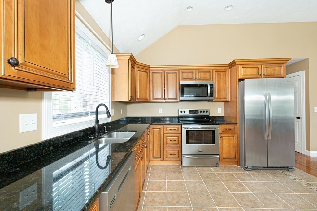 280 Maple Avenue Rutland, MA 01543 - Photo 11 of 35 a kitchen with stainless steel appliances granite countertop a sink stove and refrigerator