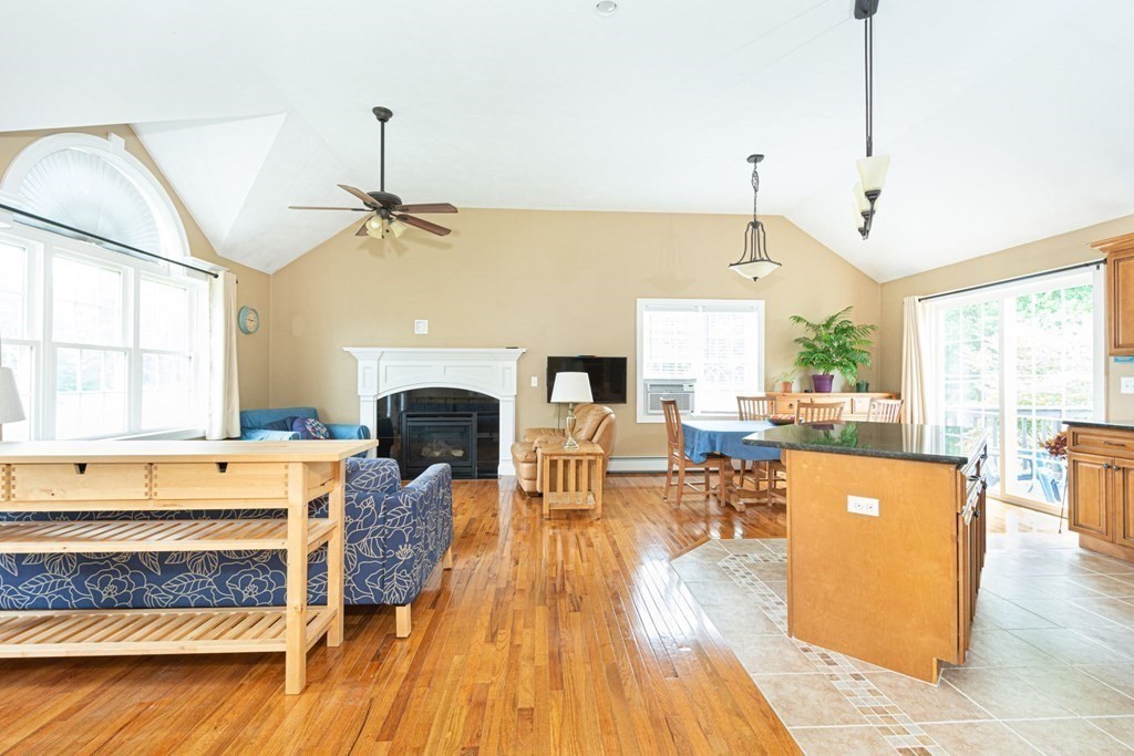 280 Maple Avenue Rutland, MA 01543 - Photo 20 of 35 a living room with furniture a fireplace and wooden floor