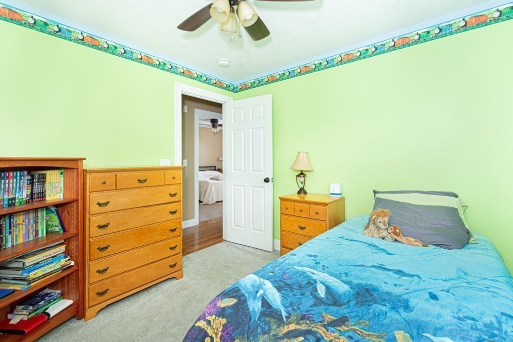 280 Maple Avenue Rutland, MA 01543 - Photo 26 of 35 a bedroom with a bed and a book shelf